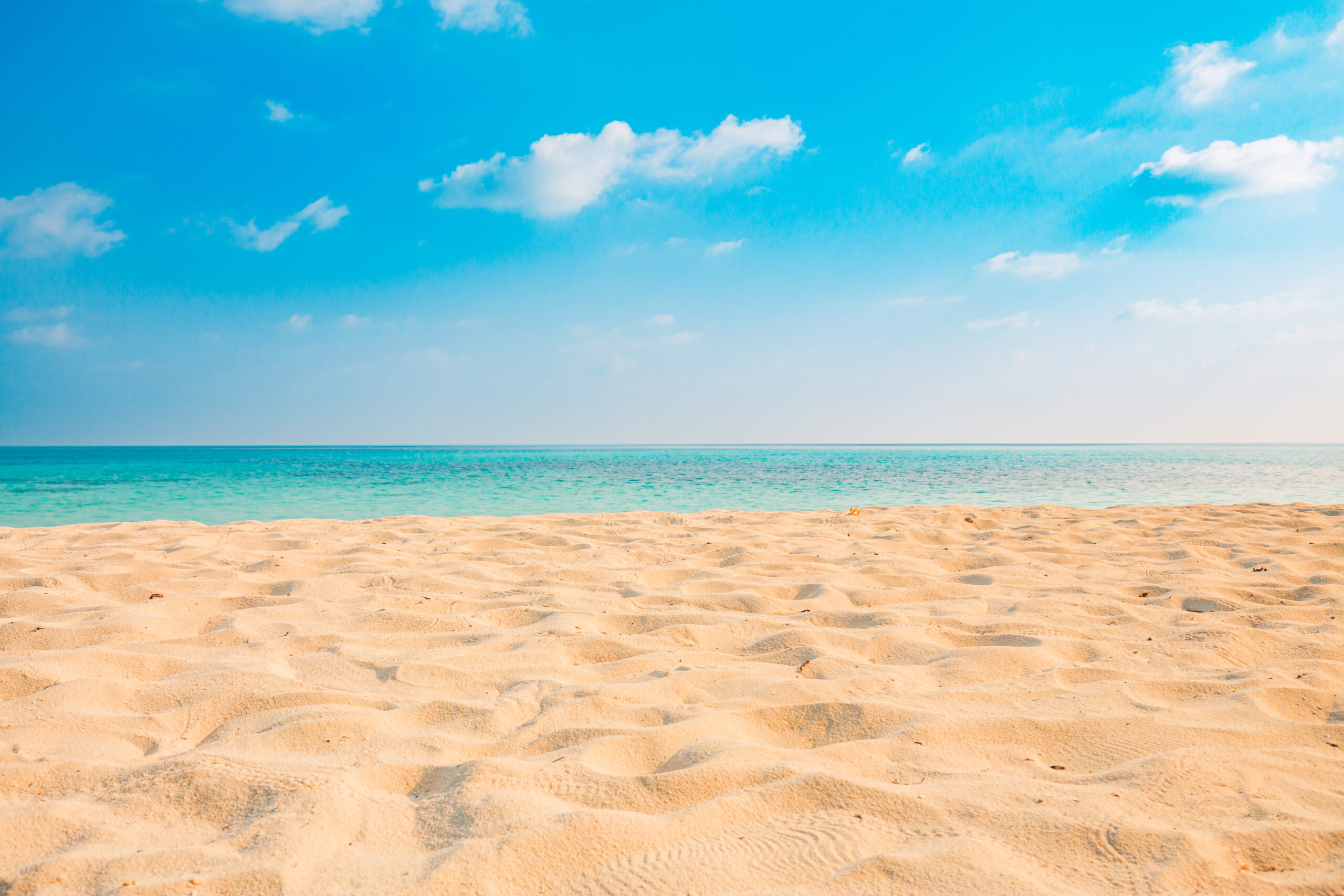 Closeup,Of,Sand,On,Beach,And,Blue,Summer,Sky.,Panoramic